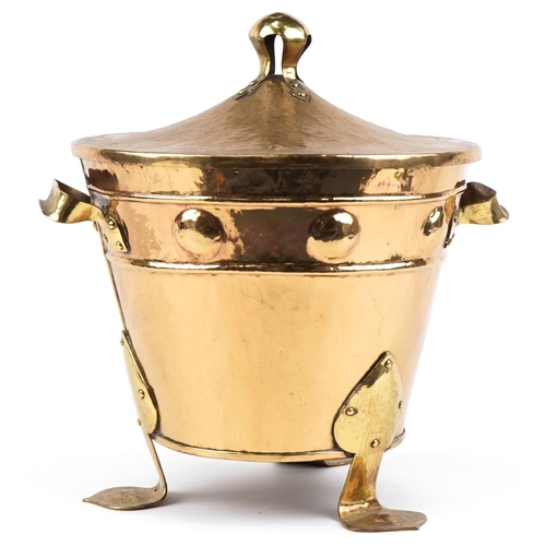 143 - Arts & Crafts brass coal bin on stylized tripod feet, 50cm high