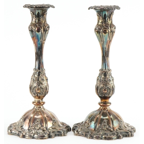 1310 - Pair of Victorian Sheffield plated candlesticks with scrolled bases, each 26cm high