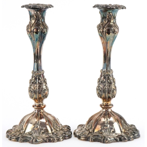 1310 - Pair of Victorian Sheffield plated candlesticks with scrolled bases, each 26cm high