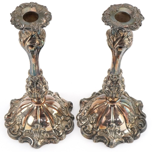 1310 - Pair of Victorian Sheffield plated candlesticks with scrolled bases, each 26cm high