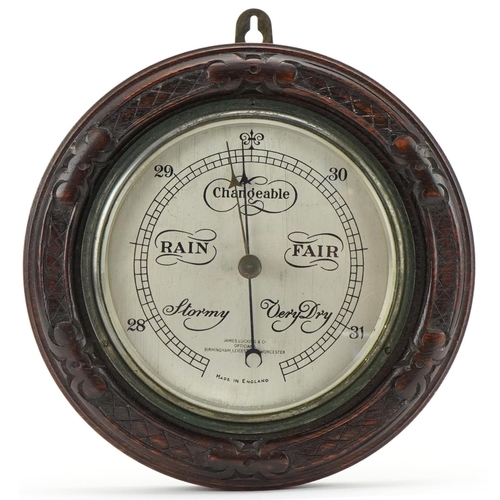 1199 - Carved oak barometer with silvered dial for James Lucking & Co Opticians Birmingham, Leicester and W... 