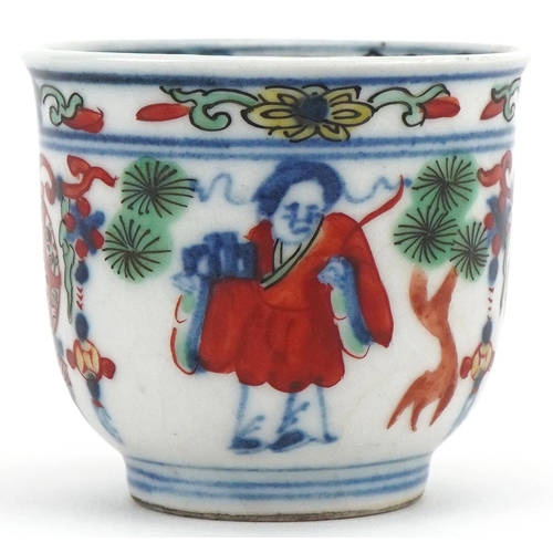 1202 - Miniature Chinese cup hand painted with objects and figures, character mark to the base, 4cm high