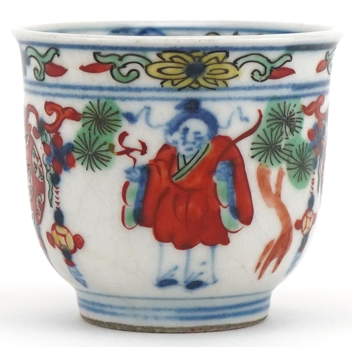 1202 - Miniature Chinese cup hand painted with objects and figures, character mark to the base, 4cm high