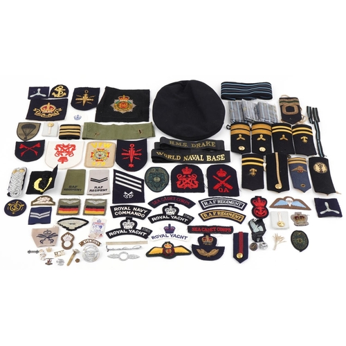 2544 - Military, RAF and naval patches, badges, pips, epaulets together with a Cameron Highlanders cap