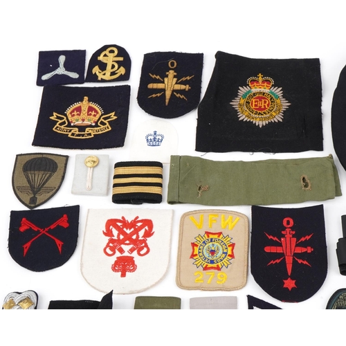 2544 - Military, RAF and naval patches, badges, pips, epaulets together with a Cameron Highlanders cap