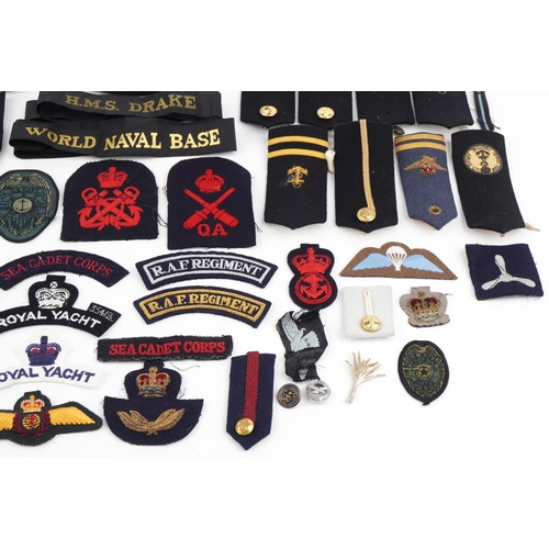 2544 - Military, RAF and naval patches, badges, pips, epaulets together with a Cameron Highlanders cap