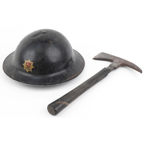 2584 - British military World War II fireman's tin helmet and axe