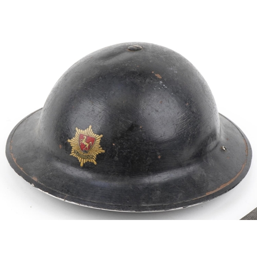 2584 - British military World War II fireman's tin helmet and axe