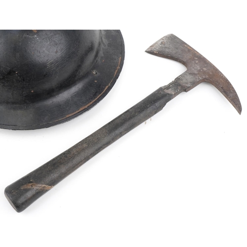 2584 - British military World War II fireman's tin helmet and axe