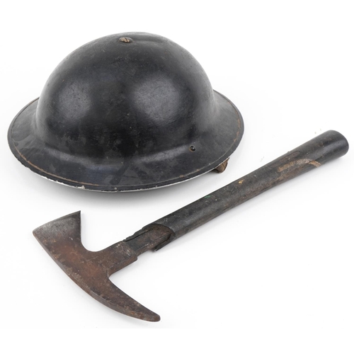 2584 - British military World War II fireman's tin helmet and axe