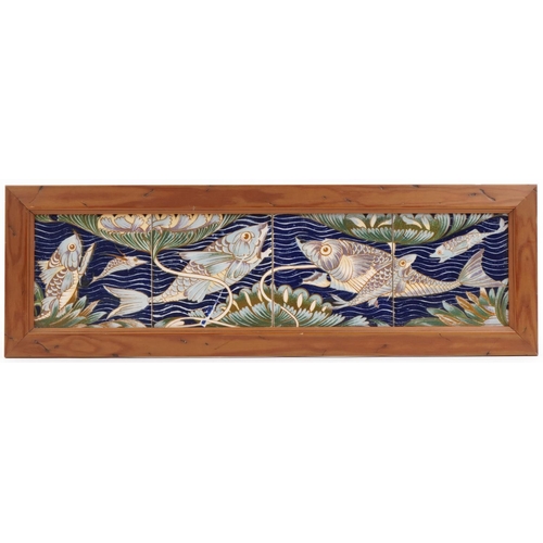 239 - William de Morgan style ceramic four tile fish panel mounted in a wooden frame, 60cm x 15cm