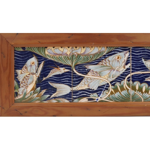 239 - William de Morgan style ceramic four tile fish panel mounted in a wooden frame, 60cm x 15cm