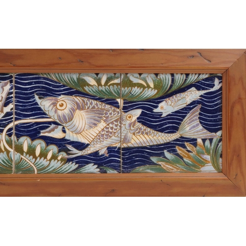 239 - William de Morgan style ceramic four tile fish panel mounted in a wooden frame, 60cm x 15cm