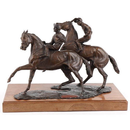 1001 - Large bronze figure group of two jockeys on horseback raised on a wooden plinth base, overall 57cm i... 