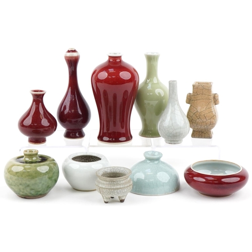 1261 - Eleven Chinese porcelain vases and bowls, some with crackle glaze, the largest 14cm high