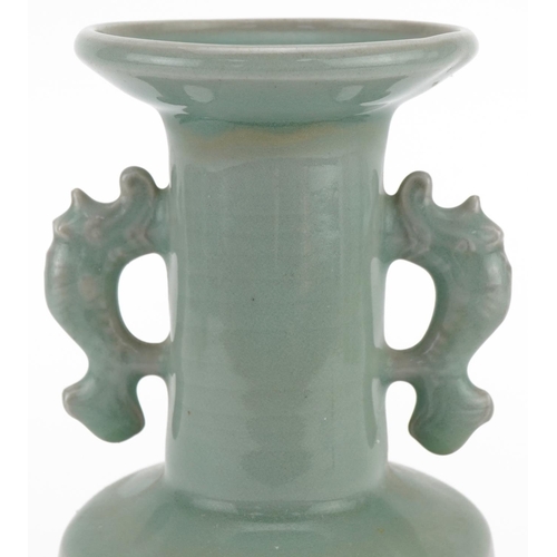 1067 - Chinese porcelain celadon glazed Rouleau vase with twin animalia handles, 19cm high