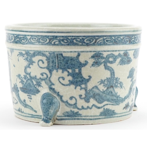 1069 - Chinese blue and white porcelain three footed incense burner hand painted with figures and pagodas, ... 