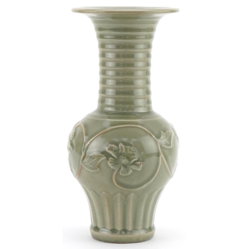 1147 - Chinese porcelain vase having a celadon glaze decorated in relief with flowering vines, 29cm high