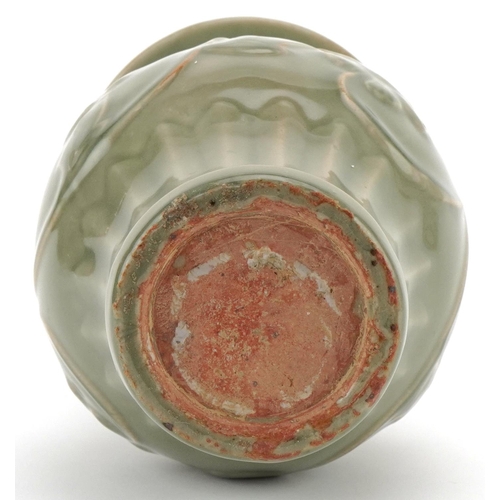 1147 - Chinese porcelain vase having a celadon glaze decorated in relief with flowering vines, 29cm high