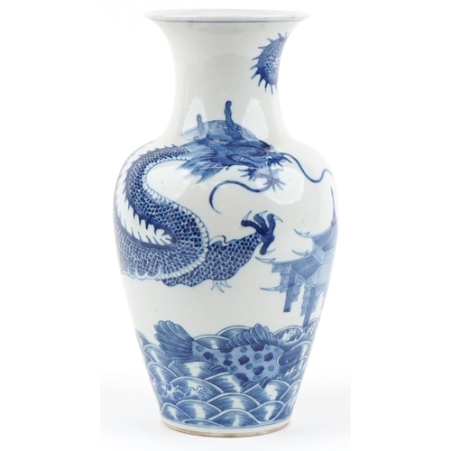 1146 - Chinese blue and white porcelain baluster vase hand painted with a dragon, pagoda and fish, four fig... 