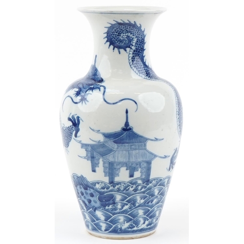 1146 - Chinese blue and white porcelain baluster vase hand painted with a dragon, pagoda and fish, four fig... 