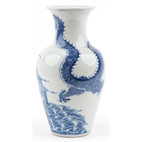 1146 - Chinese blue and white porcelain baluster vase hand painted with a dragon, pagoda and fish, four fig... 