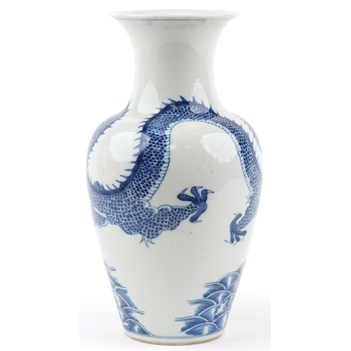 1146 - Chinese blue and white porcelain baluster vase hand painted with a dragon, pagoda and fish, four fig... 