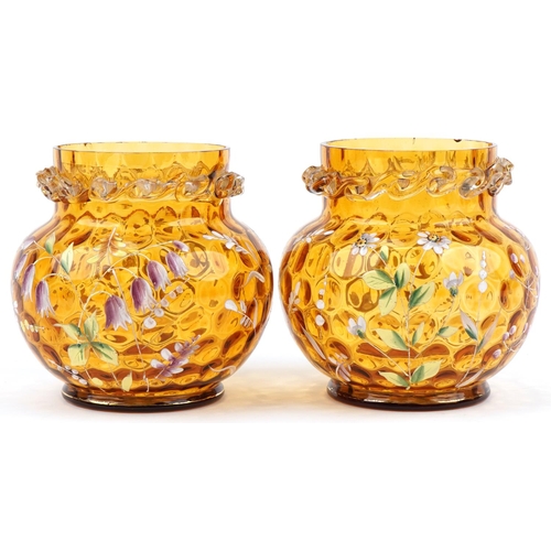 1278 - Pair of amber and clear glass vases hand enamelled with daisies and harebells, each 15cm high