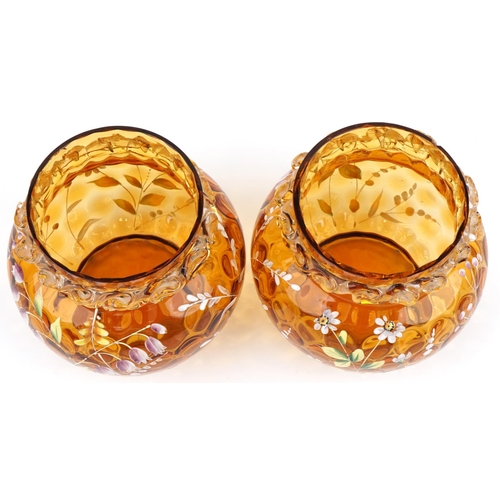 1278 - Pair of amber and clear glass vases hand enamelled with daisies and harebells, each 15cm high