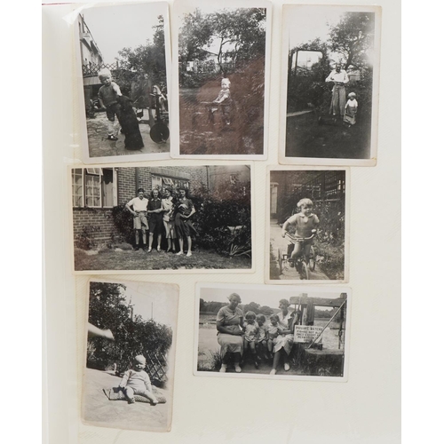 2494 - Family album of black and white photographs including motorbikes, family gatherings together with a ... 