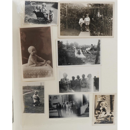 2494 - Family album of black and white photographs including motorbikes, family gatherings together with a ... 