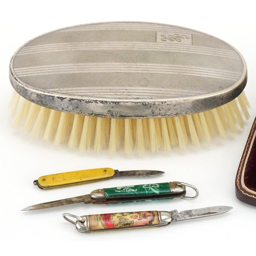 2279 - Objects including silver backed clothes brush, vintage folding fruit knives and a bronze 1924 Cobbet... 