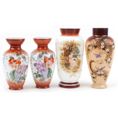 1280 - Four Victorian hand painted opaline glass vases including a pair, the largest 32.5cm high