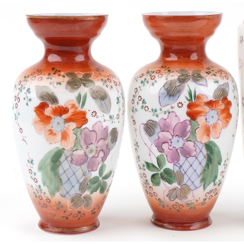 1280 - Four Victorian hand painted opaline glass vases including a pair, the largest 32.5cm high