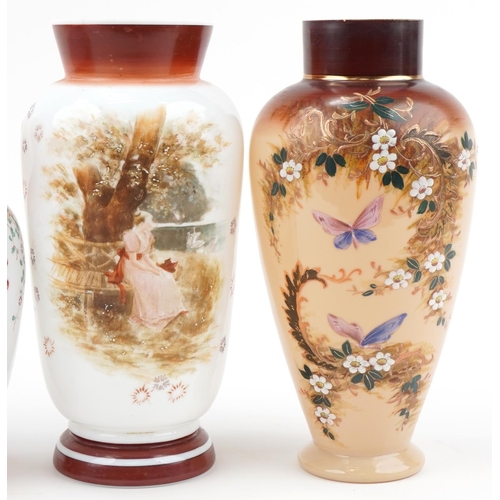 1280 - Four Victorian hand painted opaline glass vases including a pair, the largest 32.5cm high