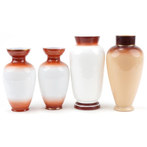 1280 - Four Victorian hand painted opaline glass vases including a pair, the largest 32.5cm high