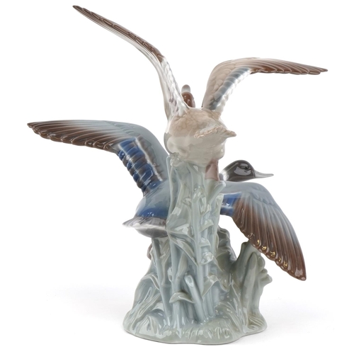 2099 - Lladro porcelain group of two ducks in flight, 31cm high