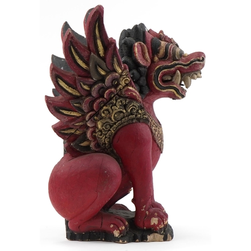 1330A - Balinese Indonesian carved wood sculpture of a mythical lion, 54cm high