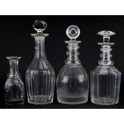 1282 - Georgian mallet shaped decanter, two Victorian glass decanters and a toddy lifter J, the largest 30c... 