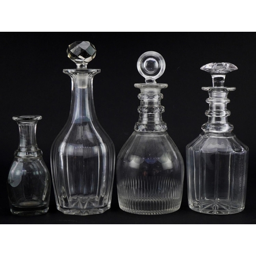 1282 - Georgian mallet shaped decanter, two Victorian glass decanters and a toddy lifter J, the largest 30c... 