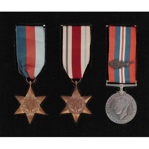 2530 - British military World War II medals including the Africa Star mounted in a glazed frame, 20cm x 17c... 