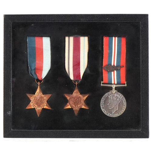 2530 - British military World War II medals including the Africa Star mounted in a glazed frame, 20cm x 17c... 