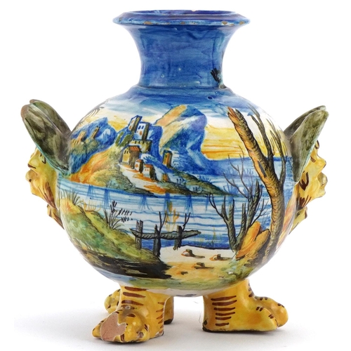 1252 - Cantagalli pottery vase hand painted with a figure beside a lake with castles,  mounted on lion paw ... 