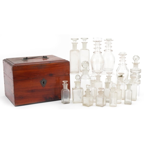 1173 - Selection of Victorian glass apothecary bottles housed in a wooden case along decanter bottles, the ... 