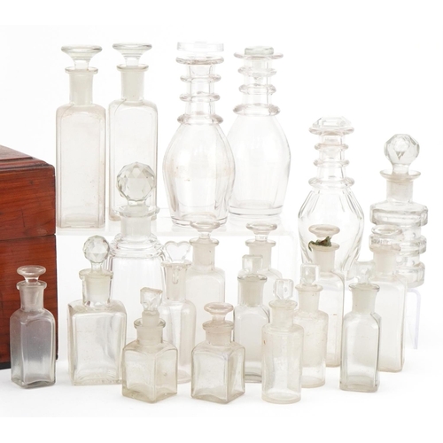 1173 - Selection of Victorian glass apothecary bottles housed in a wooden case along decanter bottles, the ... 