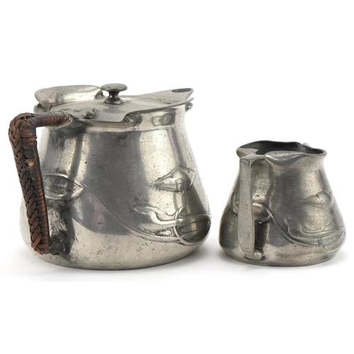 53A - Archibald Knox for Liberty's Tudric pewter teapot and matching twin handled sugar bowl,  numbered 02... 