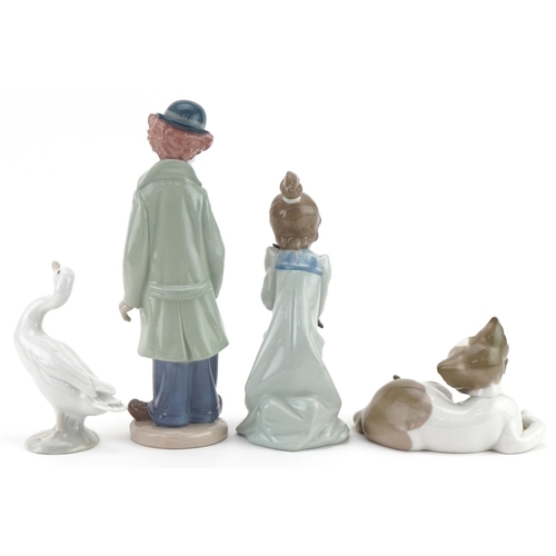 2100 - Four Lladro figures and animals including a clown and a young girl with kitten, the largest 22.5cm h... 