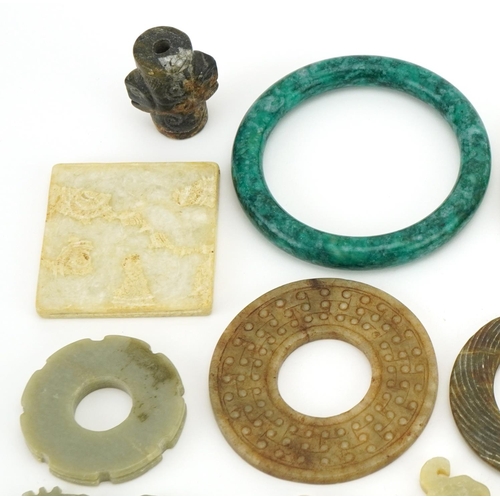 3552 - Collection of Chinese and Middle Eastern carved stone jewellery including pendants and bangles