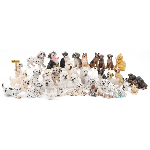 2311 - Large collection of decorative resin model dogs including Regency Fine Art, the largest 18cm high