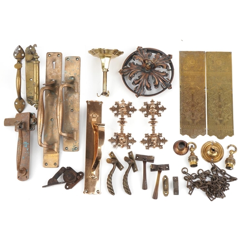 148 - Arts & Crafts metalware including doorplates, ceiling light fittings and window catches, the largest... 